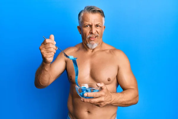 Middle Age Grey Haired Man Shirtless Eating Measure Meter Doing — Φωτογραφία Αρχείου