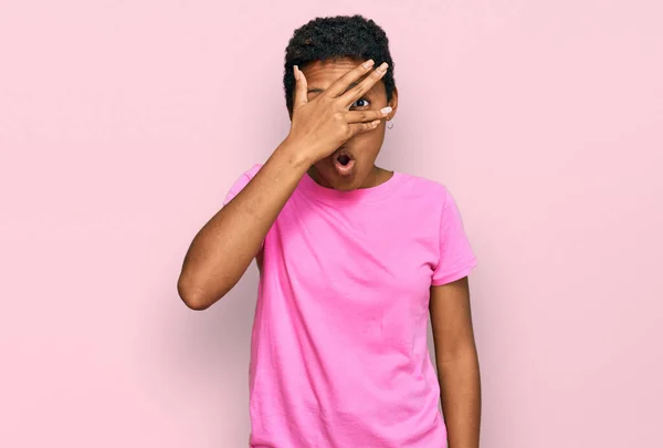 Young African American Woman Wearing Casual Clothes Peeking Shock Covering — Stock Photo, Image