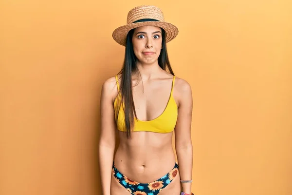 Young Hispanic Woman Wearing Bikini Summer Hat Puffing Cheeks Funny — Stock Photo, Image