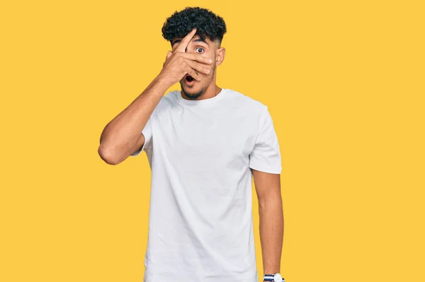 Young Arab Man Wearing Casual White Shirt Peeking Shock Covering — Stock Fotó