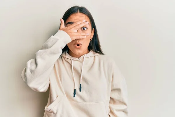 Young Asian Woman Wearing Casual Sweatshirt Peeking Shock Covering Face — Stok fotoğraf