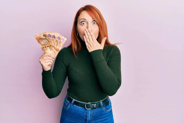 Beautiful Redhead Woman Holding South African Rand Banknotes Covering Mouth — Fotografia de Stock