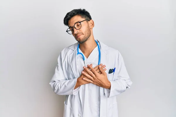 Young Handsome Man Wearing Doctor Uniform Stethoscope Smiling Hands Chest — Stock Photo, Image