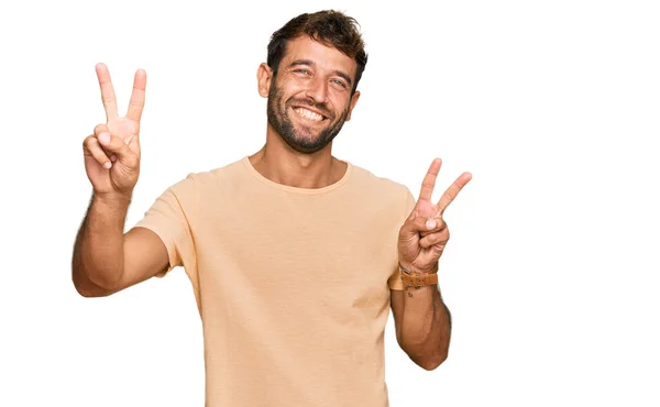 Joven Guapo Con Barba Vistiendo Camiseta Casual Sonriendo Con Lengua —  Fotos de Stock