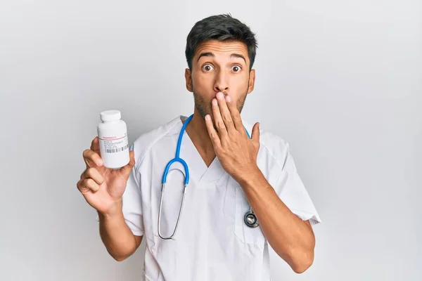 Young Handsome Man Wearing Doctor Uniform Holding Presciption Pills Covering — Stock Photo, Image