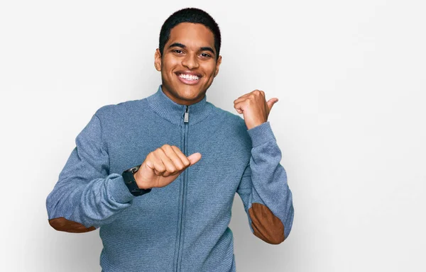 Young Handsome Hispanic Man Wearing Casual Sweatshirt Pointing Back Hand — Stock Photo, Image