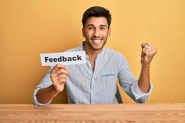 Young Handsome Man Holding Feedback Paper Customer Evaluation Screaming Proud — Stock Photo, Image