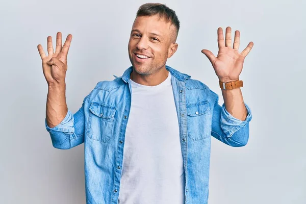 Handsome Muscle Man Wearing Casual Denim Jacket Showing Pointing Fingers — Stock Photo, Image