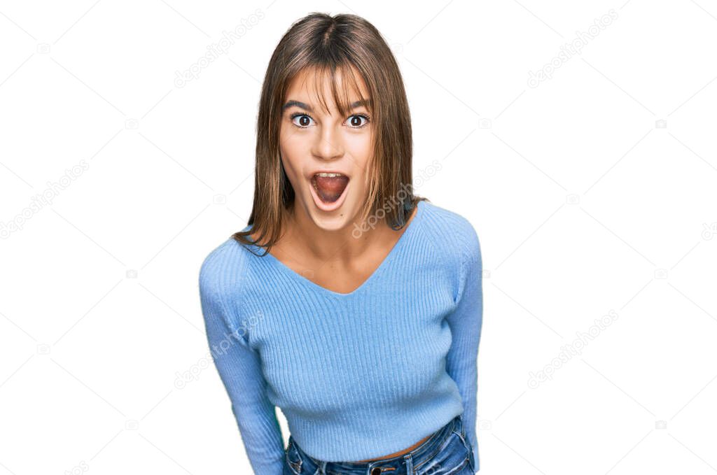 Teenager caucasian girl wearing casual clothes afraid and shocked with surprise expression, fear and excited face. 