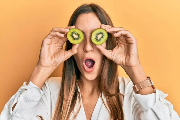 Young Beautiful Woman Holding Slice Kiwi Eyes Afraid Shocked Surprise — Stock Photo, Image