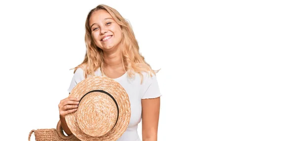 Young Blonde Girl Holding Summer Hat Wicker Handbag Looking Positive — Stock Photo, Image