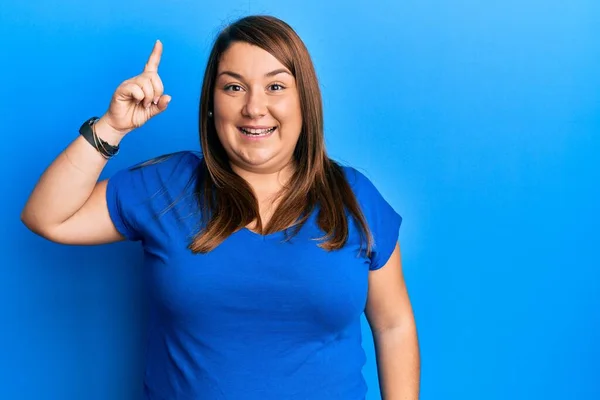 Beautiful Brunette Size Woman Wearing Casual Blue Shirt Pointing Finger — Stock Photo, Image