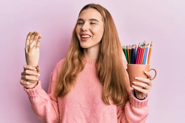 Young Blonde Woman Holding Small Wooden Manikin Hand Pencils Smiling — Stock Photo, Image