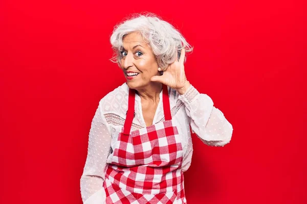Senior Grey Haired Woman Wearing Apron Smiling Hand Ear Listening —  Fotos de Stock