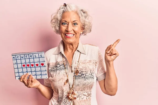 Senior Grey Haired Woman Holding Heart Calendar Smiling Happy Pointing — Stock Photo, Image