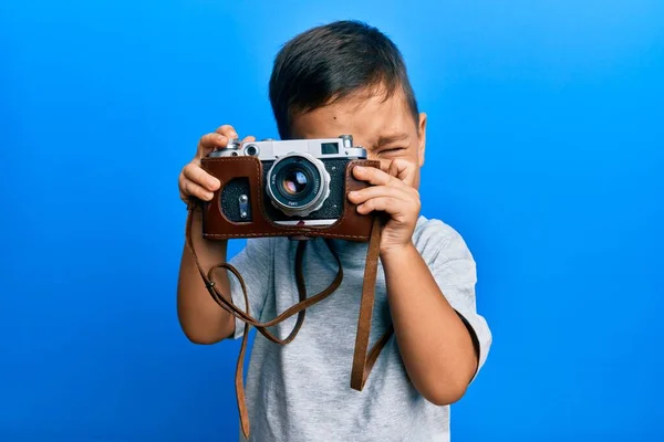 Adorable Latin Photographer Toddler Smiling Happy Using Vintage Camera Isolated — Stock Photo, Image