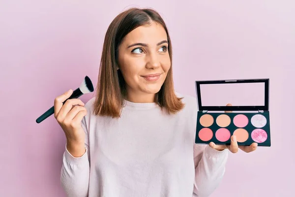 Young Beautiful Woman Holding Makeup Brush Blush Smiling Looking Side — Stock fotografie