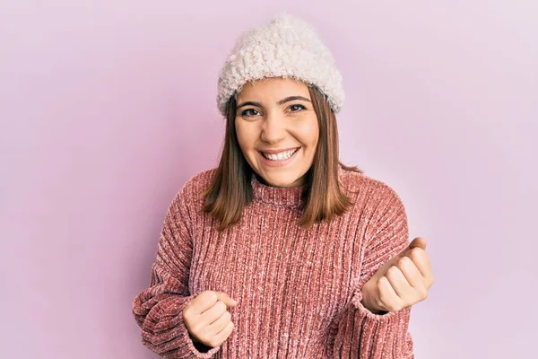 Young Beautiful Woman Wearing Wool Sweater Winter Hat Celebrating Surprised —  Fotos de Stock