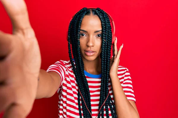 Beautiful Hispanic Woman Taking Selfie Photo Wearing Headphones Thinking Attitude — Stockfoto