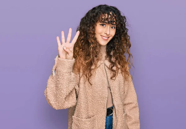 Young Hispanic Girl Wearing Winter Clothes Showing Pointing Fingers Number —  Fotos de Stock