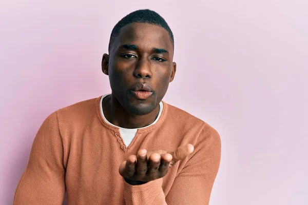 Young African American Man Wearing Casual Clothes Looking Camera Blowing — Stock Photo, Image