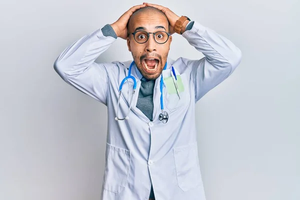 Hispanic Adult Man Wearing Doctor Uniform Stethoscope Crazy Scared Hands — 스톡 사진