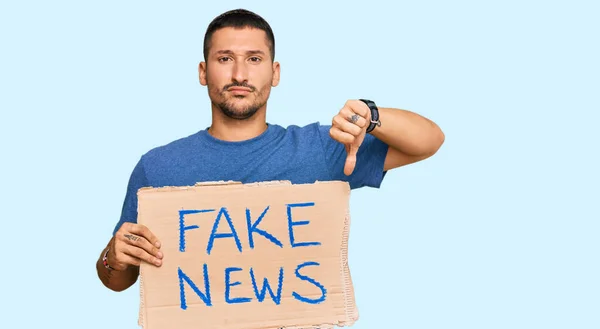 Handsome Man Tattoos Holding Fake News Banner Angry Face Negative — 스톡 사진