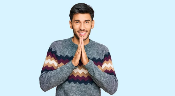 Young Handsome Man Wearing Casual Winter Sweater Praying Hands Together — 图库照片