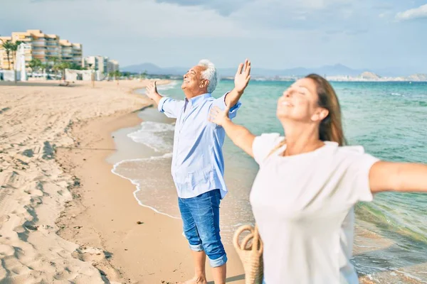 Middle Age Hispanic Couple Breathing Arms Raised Beach — Stock Photo, Image