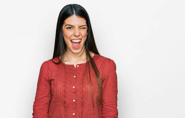 Young hispanic woman wearing casual clothes winking looking at the camera with sexy expression, cheerful and happy face. — Stock Image Young Hispanic Woman Wearing Casual Clothes Winking Looking Camera Sexy Royalty Free Stock Images
