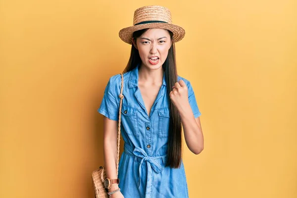 Young Chinese Woman Wearing Summer Hat Angry Mad Raising Fist — 스톡 사진