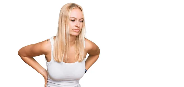 Young Blonde Girl Wearing Casual Style Sleeveless Shirt Suffering Backache — Stock Photo, Image