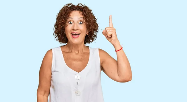 Beautiful Middle Age Mature Woman Wearing Casual White Shirt Pointing Stock Photo