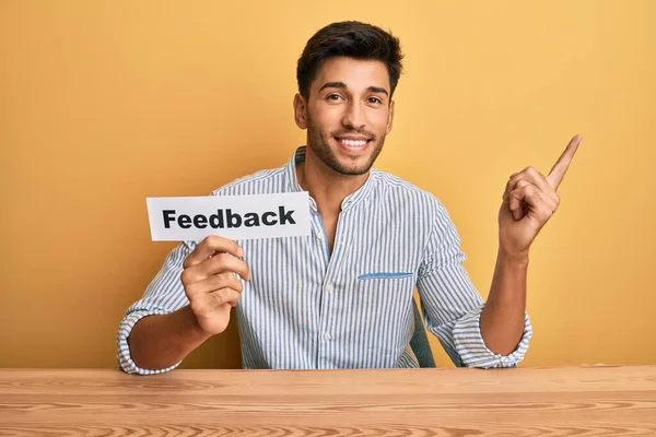 Young Handsome Man Holding Feedback Paper Customer Evaluation Smiling Happy — Stock Photo, Image