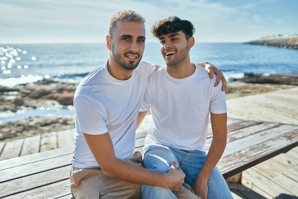 Young Gay Couple Smiling Happy Sitting Bench Beach Promenade — Stock Photo, Image