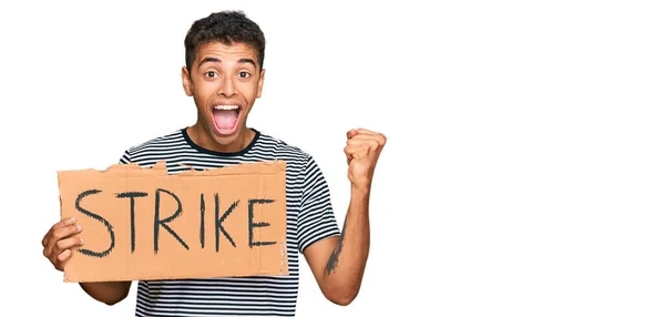 Young Handsome African American Man Holding Strike Banner Cardboard Screaming — Stock Photo, Image