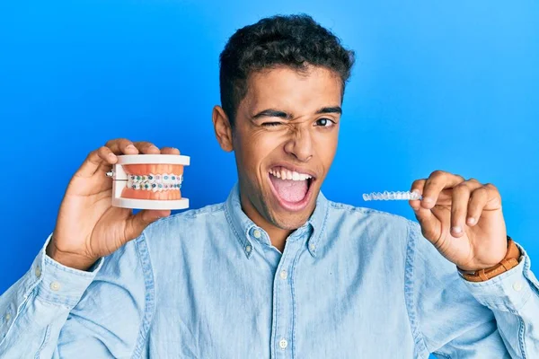 Young Handsome African American Man Holding Invisible Aligner Orthodontic Braces — Fotografia de Stock