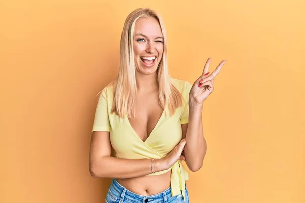 Young Blonde Girl Wearing Casual Clothes Smiling Happy Face Winking — Stock Photo, Image