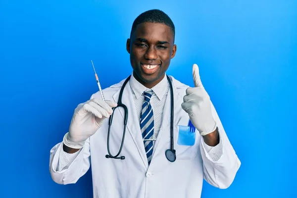 Young African American Doctor Man Holding Syringe Surprised Idea Question — Stock Photo, Image