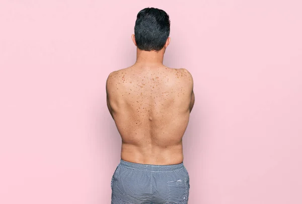 Handsome Young Man Wearing Swimwear Shirtless Standing Backwards Looking Away — Stock Photo, Image