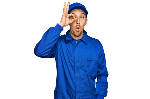 Bald Man Beard Wearing Builder Jumpsuit Uniform Doing Gesture Shocked — Stock Photo, Image