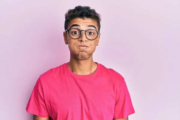 Young Handsome African American Man Wearing Glasses Pink Background Puffing — Stok fotoğraf