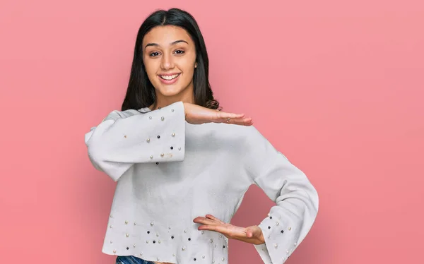 Young Hispanic Girl Wearing Casual Clothes Gesturing Hands Showing Big — Stock Photo, Image