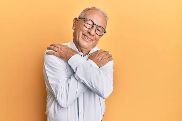 Senior Caucasian Man Wearing Casual Clothes Glasses Hugging Oneself Happy — Stock Photo, Image