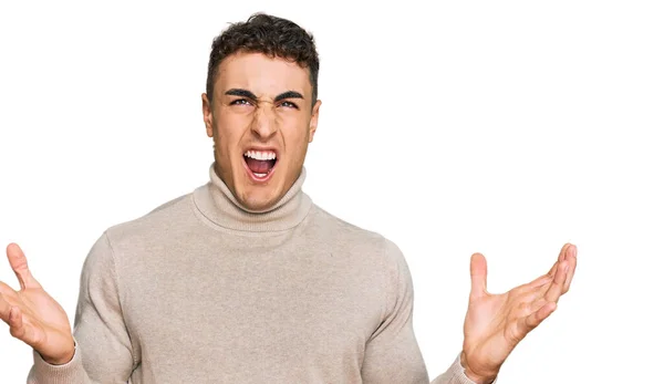 Hispanic Young Man Wearing Casual Turtleneck Sweater Crazy Mad Shouting — Stock Photo, Image