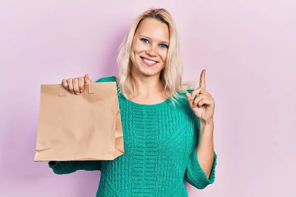 Beautiful Caucasian Blonde Woman Holding Take Away Paper Bag Smiling — Photo