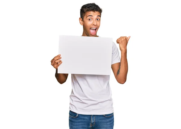 Young Handsome African American Man Holding Blank Empty Banner Pointing — Stock Photo, Image