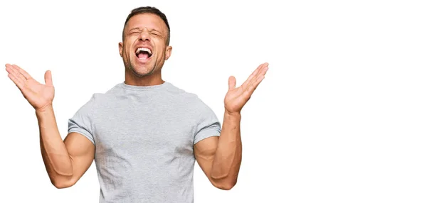 Handsome Muscle Man Wearing Casual Grey Tshirt Celebrating Mad Crazy — Stock Photo, Image