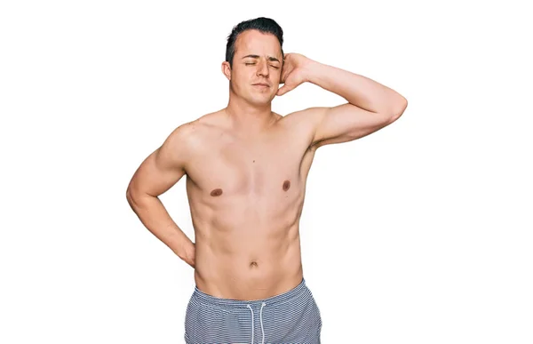 Handsome Young Man Wearing Swimwear Shirtless Suffering Neck Ache Injury — Stock Photo, Image