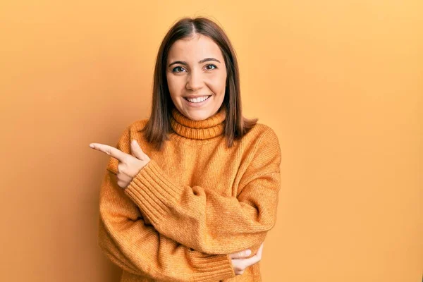 Young Beautiful Woman Wearing Turtleneck Sweater Smiling Cheerful Pointing Hand — ストック写真